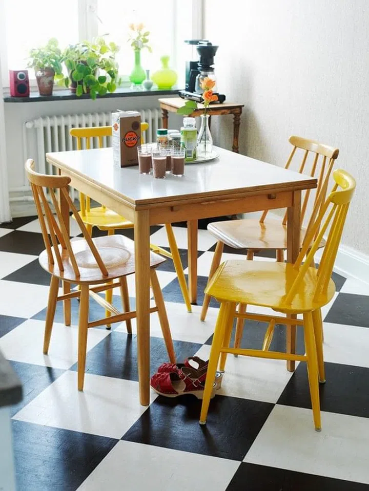 Similarly, match the bold checkered floor with an even bolder colour - bright yellow! It adds a fun vibe to the space. Image by We Heart It.