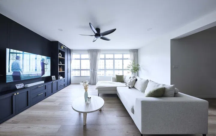 Living room in a 32-year-old man's 5-room HDB in Tampines Ave 8.