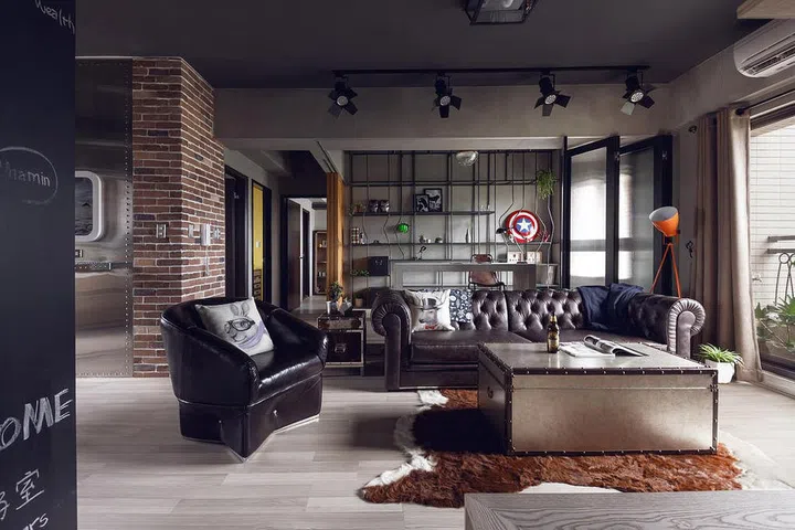 A folding screen helps to separate the study from the living area when necessary, but when unfolded the space becomes a wide and stunning den with a lounge-like feel. Interior design by Hao Design.