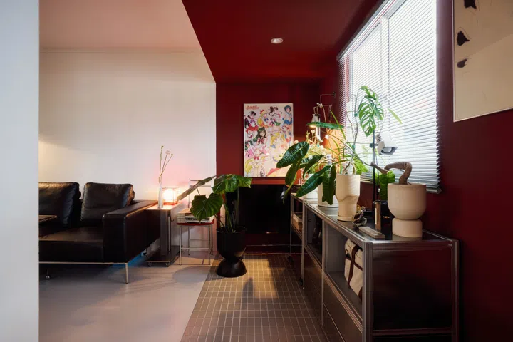 The cherry-red entrance foyer is an extension of the HDB building’s signature red facade.