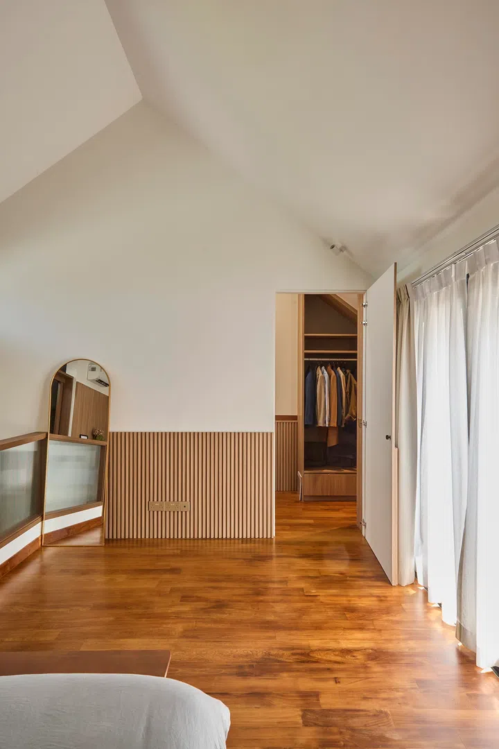Openings are kept discreet, allowing the attic to read as one continuous volume.