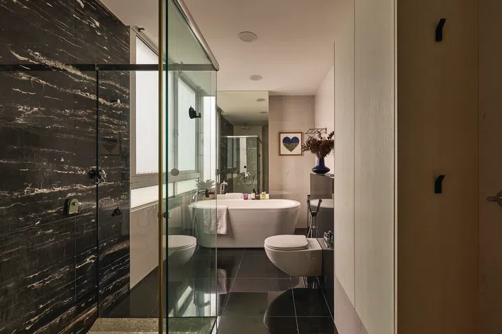 A freestanding bathtub sits in the master bathroom.