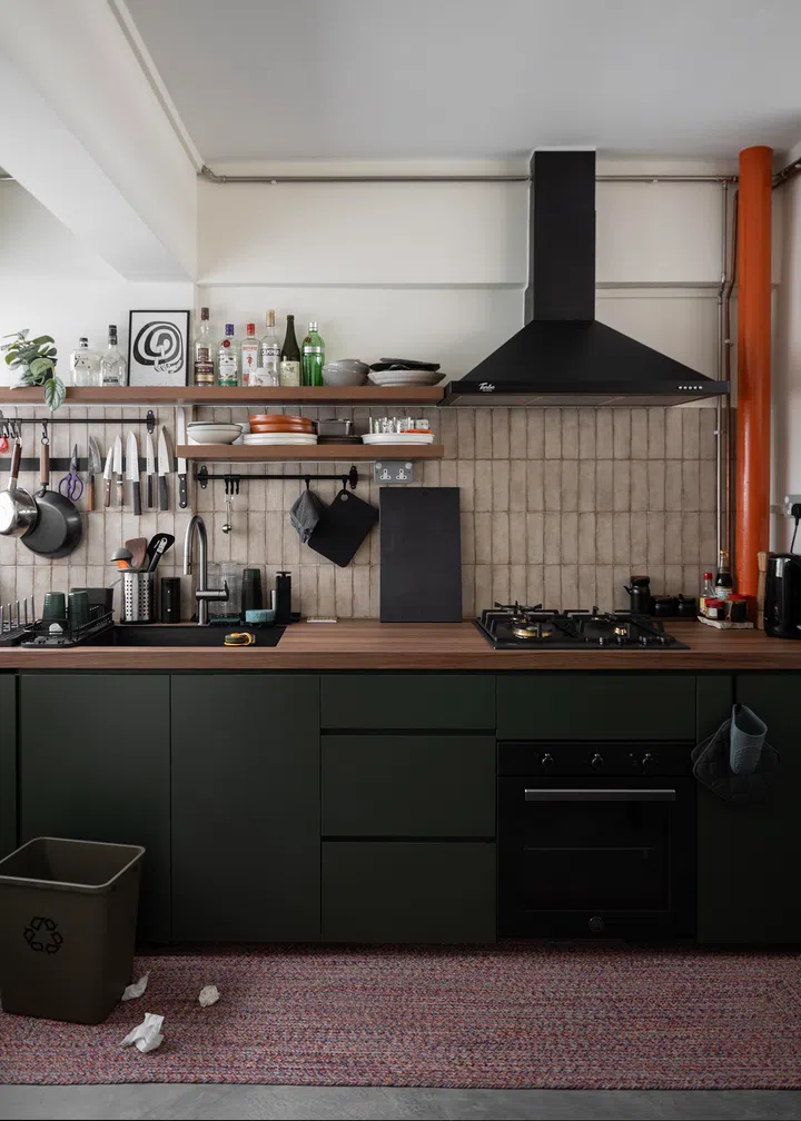 Open shelves line the kitchen of a 4-room HDB resale flat in MacPherson.