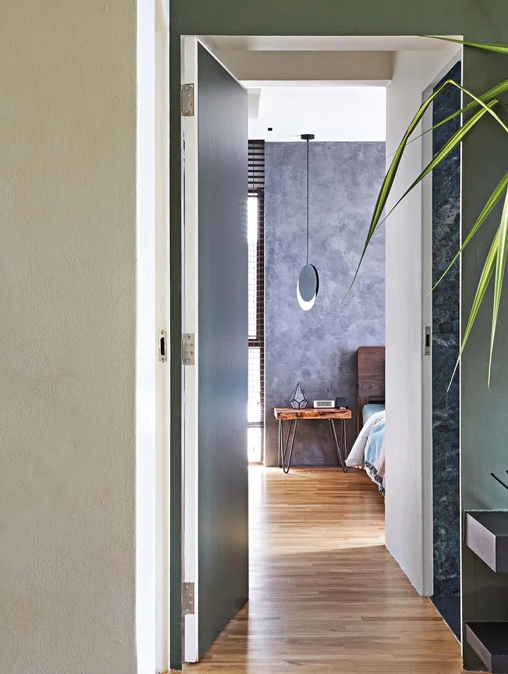 Corridor aisle way clad in wood flooring. Interior design by Bowerman Interior Planner.