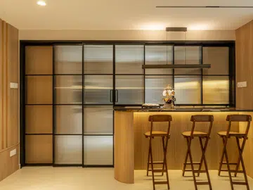 Light wood accents create an illusion of a bigger, more open-plan feel. Photography by Daniel Koh. 