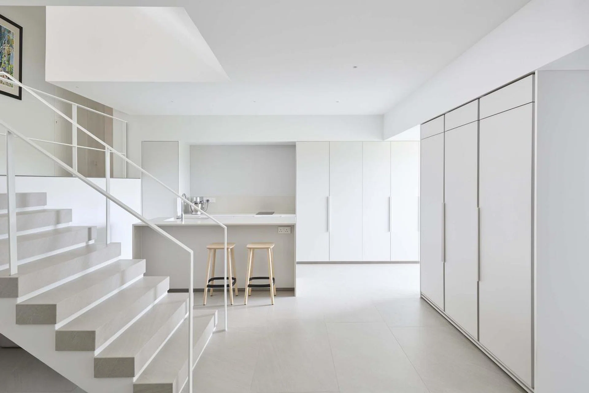 All white kitchen in a 3,500 sq ft 4-bedroom Pandan Valley condo.