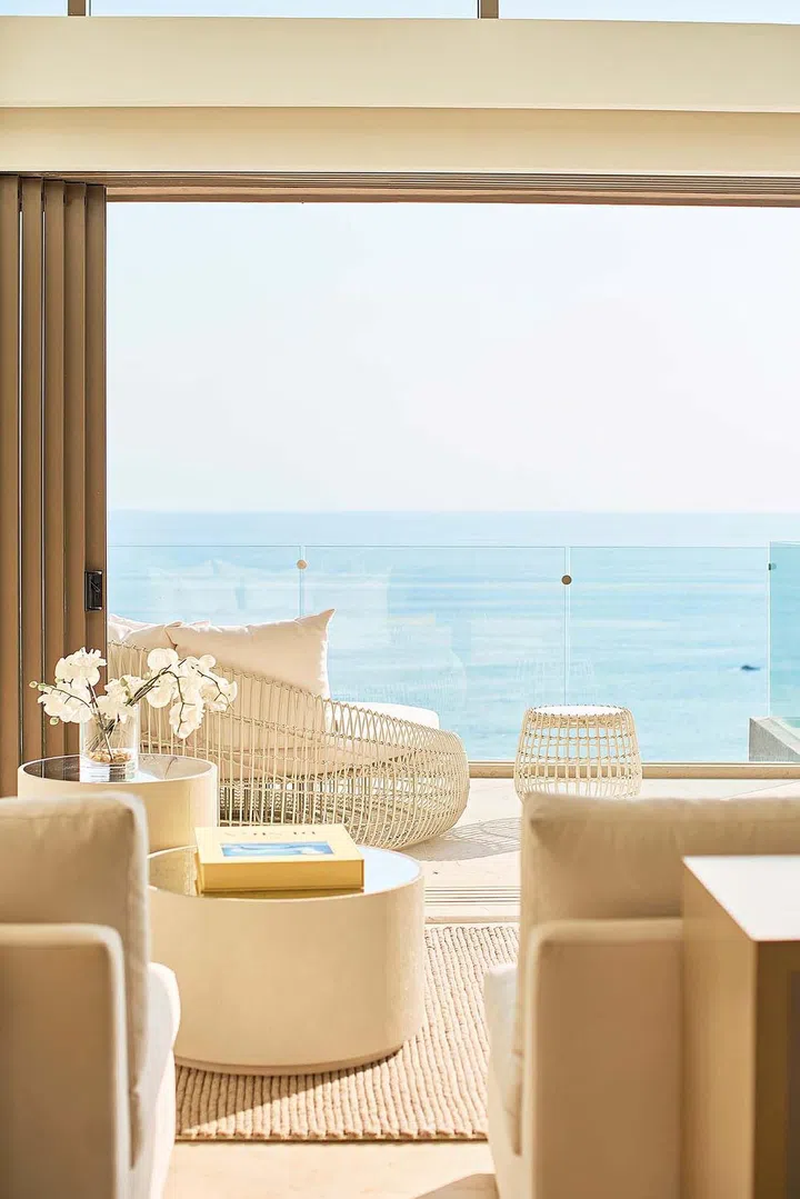 The low table and ikebana-style vase complete the Zen vibe.