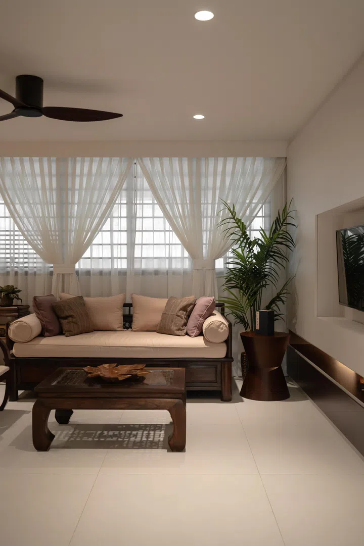 The living room is blessed with natural lighting. Opting for white semi-sheer curtains doubles as a light filter. 
