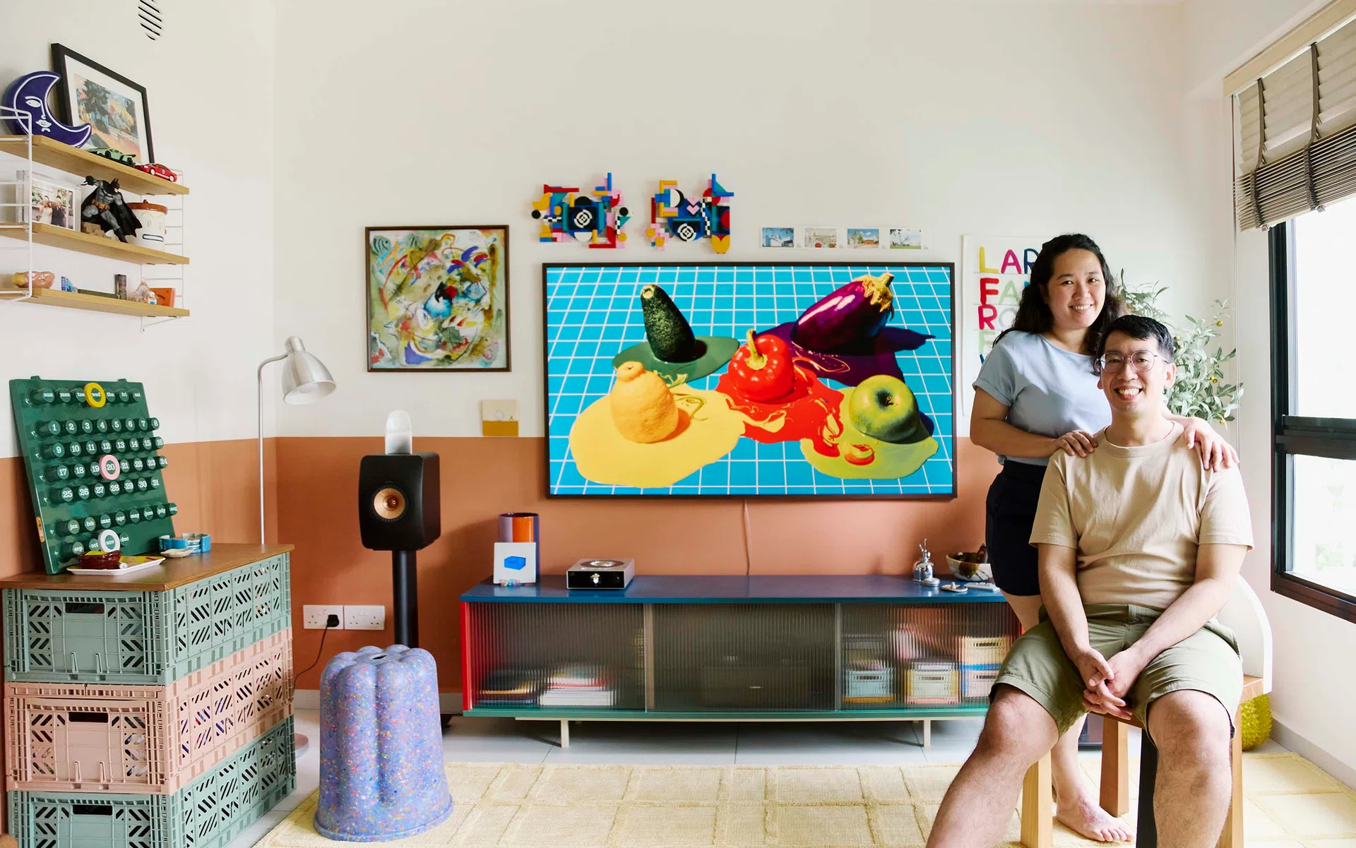 The couple, Vanessa and Ricardo, relaxing in their colourful, personality-filled living room.