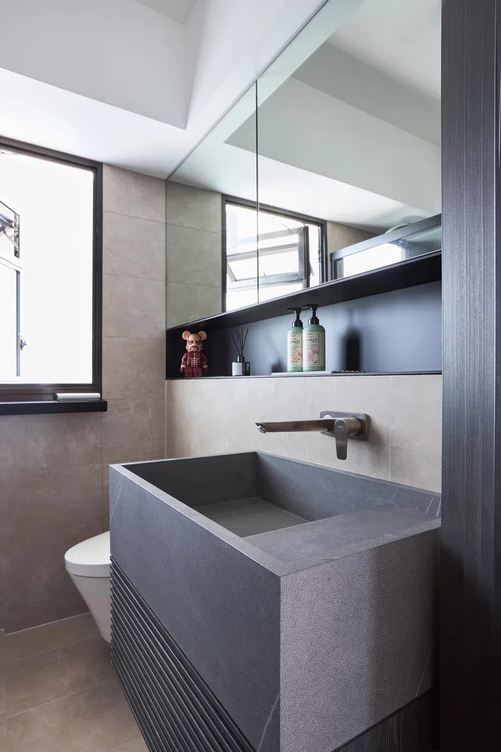 Common bathroom in a couple’s 4-room BTO (1,001 sq ft) in Punggol.