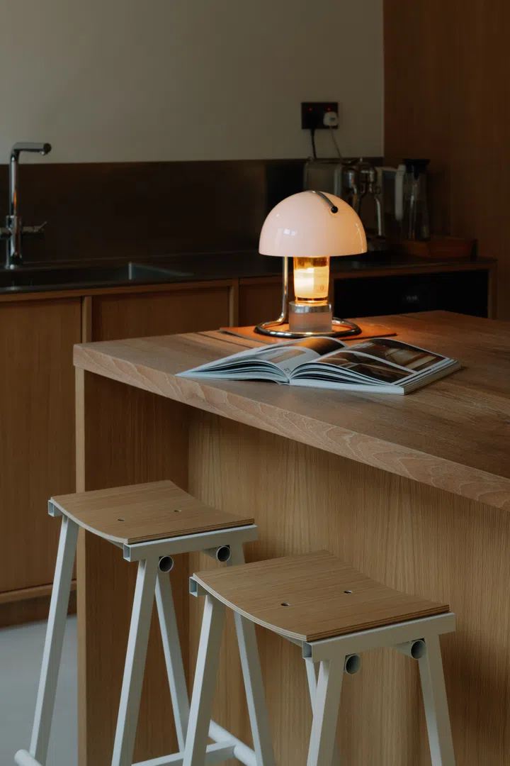 More than a breakfast bar, the island serves as a practical preparation station and an informal gathering spot for family and friends.