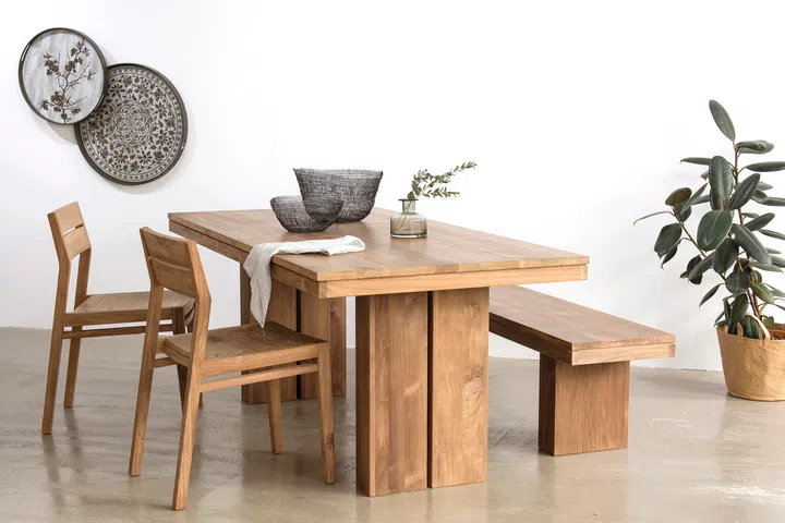 Flexible seating choices, such as benches that tuck neatly away, can help smaller dining areas feel more open and usable when guests are not around.