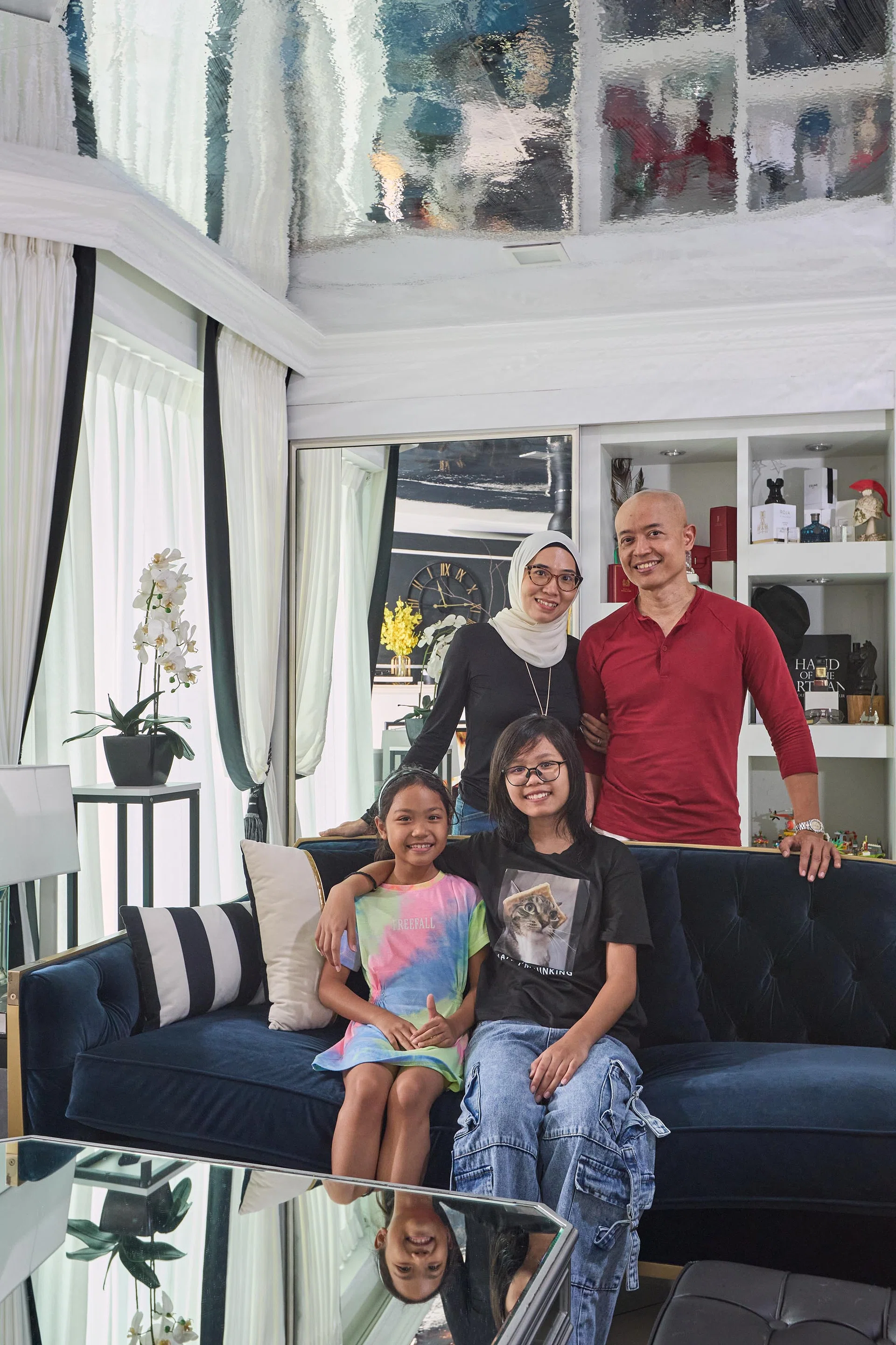 A nurse and teacher, their two young daughters and two cats live in this 5-room HDB DBSS at Ang Mo Kio Street 52 (1,206 sq ft), designed by Black & White Haus.