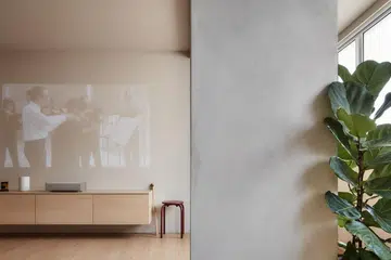 A  floating television console also doubles up as a shoe cabinet as it is right beside the main entrance.