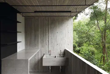 Many of the spaces in the Chempanai House in Kuala Lumpur appear completely surrounded by green foliage as they hover close to the tropical canopy.