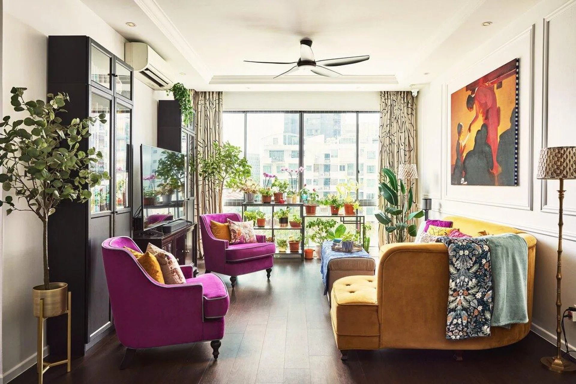 A living room dazzling in splashes of bright colours, cultural influences, and heritage items in this 3-bedroom condominium along Balestier Road.