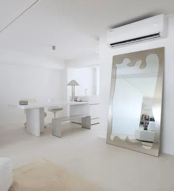 In this home, the kitchen and dining table/area are intertwined. 
