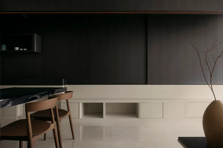 Dark timber frames the open living and dining area, lending a quiet sense of calm and ease to this 3-bedroom (1,098 sq ft) condo in Penrose.