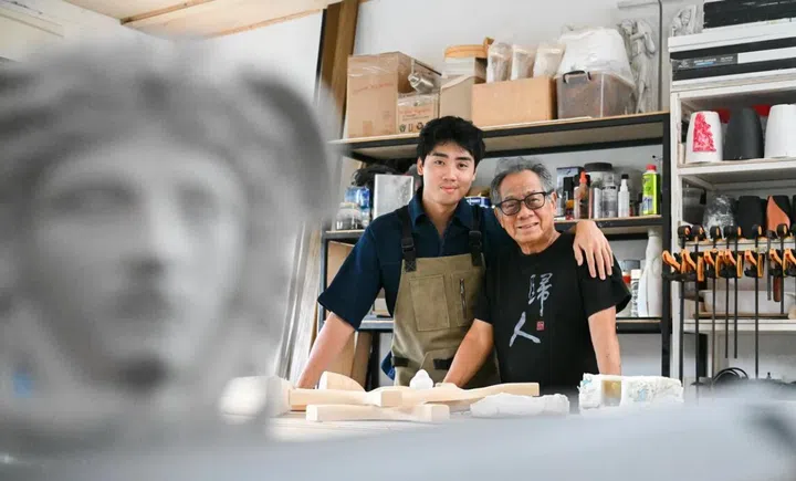 Tan Cheng Whatt and his grandson Tyrus Hong inspire each other when they work in Tan’s home carpentry workshop. A Medusa figurine, fashioned by Tan, is a mini-monument to his grit and inventiveness with furniture-making.