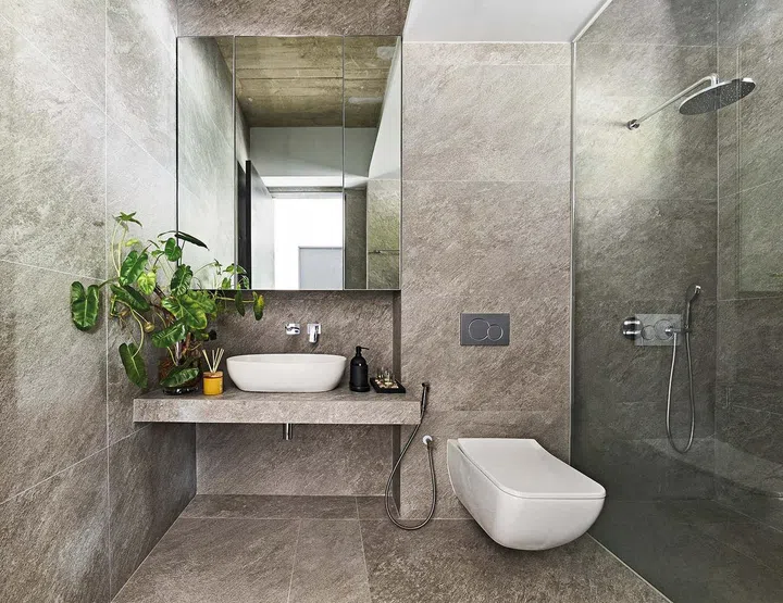 The first storey powder room also doubles up as a convenient place to give the family pet dog his bath as it is right next to his favourite sunken patio play area.