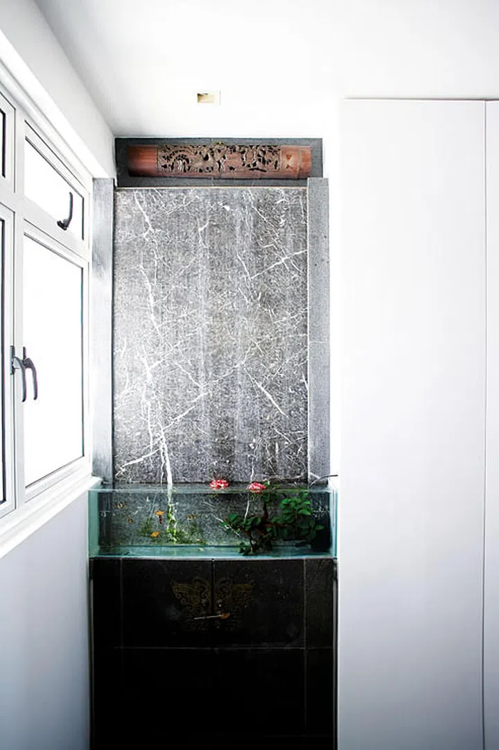 The fish tank and water feature represent cleansing and purge the “bad” elements brought about by the rubbish chute beneath.