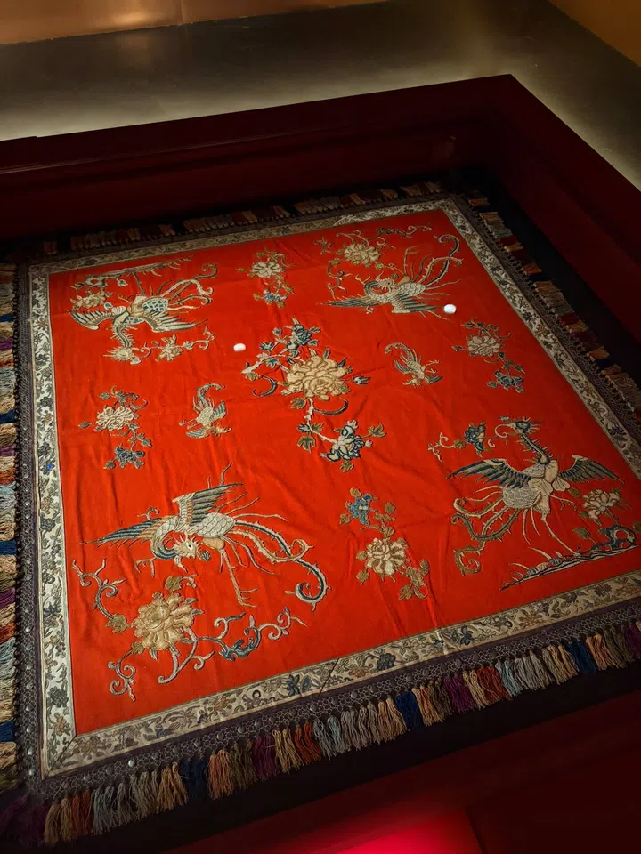 An imported European wool cloth with pre-made patterns handsewn likely by Nonyas at home. This prayer tablecloth was likely  used to present food offerings for prayers.