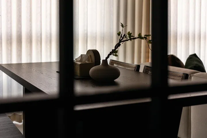 The divider filters views through the home, balancing openness with just enough privacy for work or entertaining.