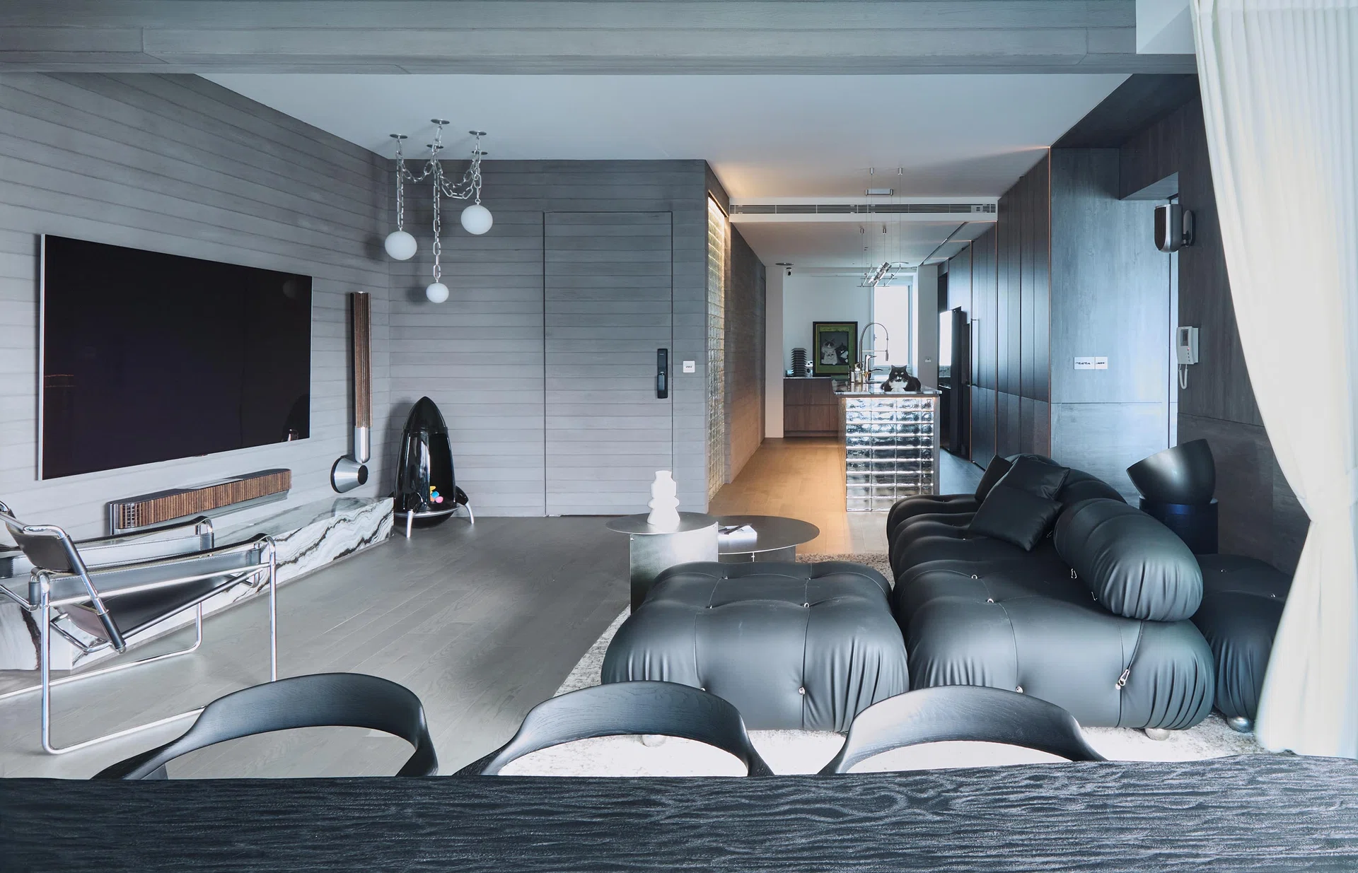 Living room view of Sol Luminaire co-founder’s 3-bedroom condominium at Amber Road (1, 798 sq ft), designed by Spacebar Design.