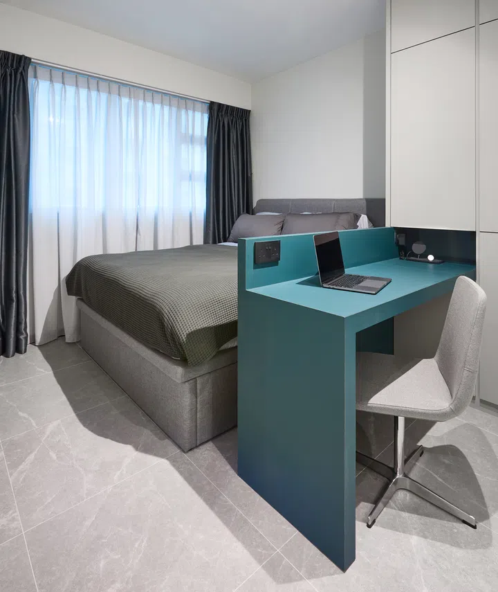 An integrated work desk within the master bedroom wardrobe, blending functionality and space-saving design.