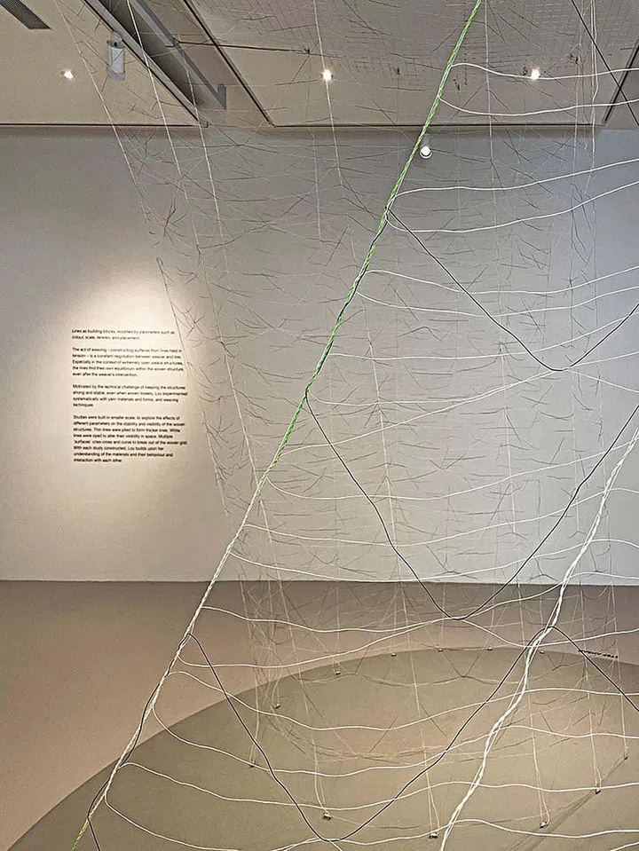 Weaving in an exaggerated scale using a three-dimensional loom at Singapore Art Week 2023.