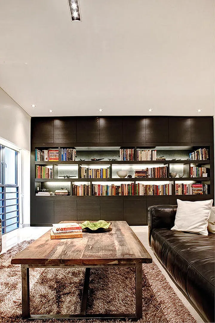bookshelf, book display, books, shelf, cabinet, dark wood, wood coffee table, sofa