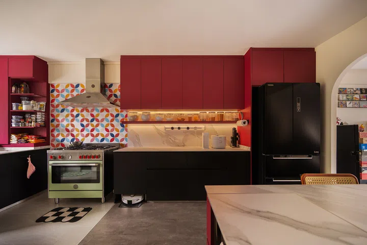 The colourful stove backsplash comprises of 10cm stickers applied individually by Jumadi and Siti.