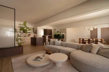 An open-plan living, dining, and kitchen layout replaces the home’s original compartmentalised plan, creating a warm, fluid space designed for everyday family life.