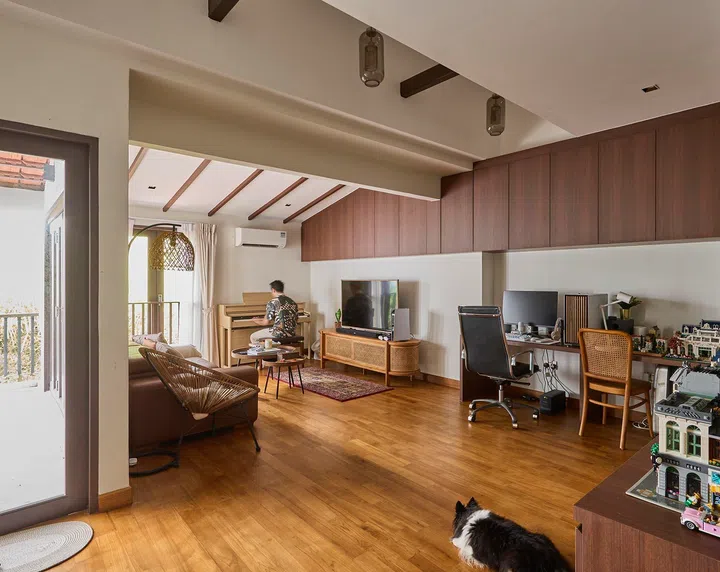 Part study, part retreat, the space incorporates a work desk and a long display ledge that houses books and a Lego collection.