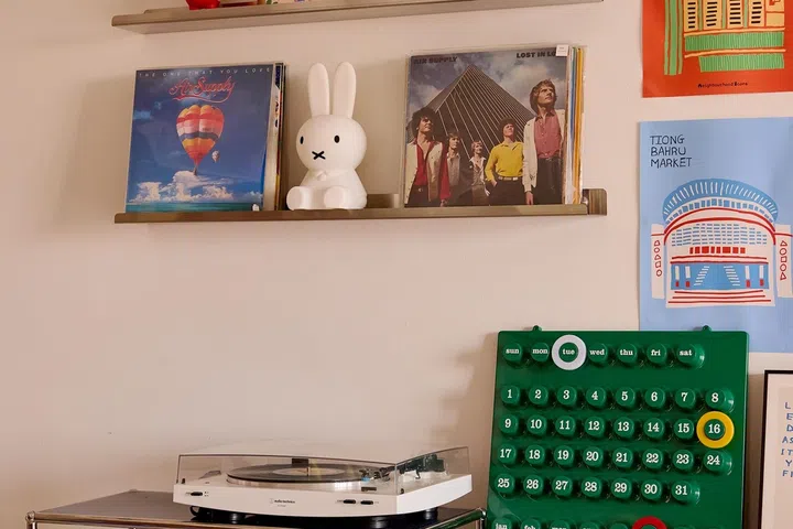 Baby toys and colourful everyday objects are displayed in plain sight instead of being hidden away.