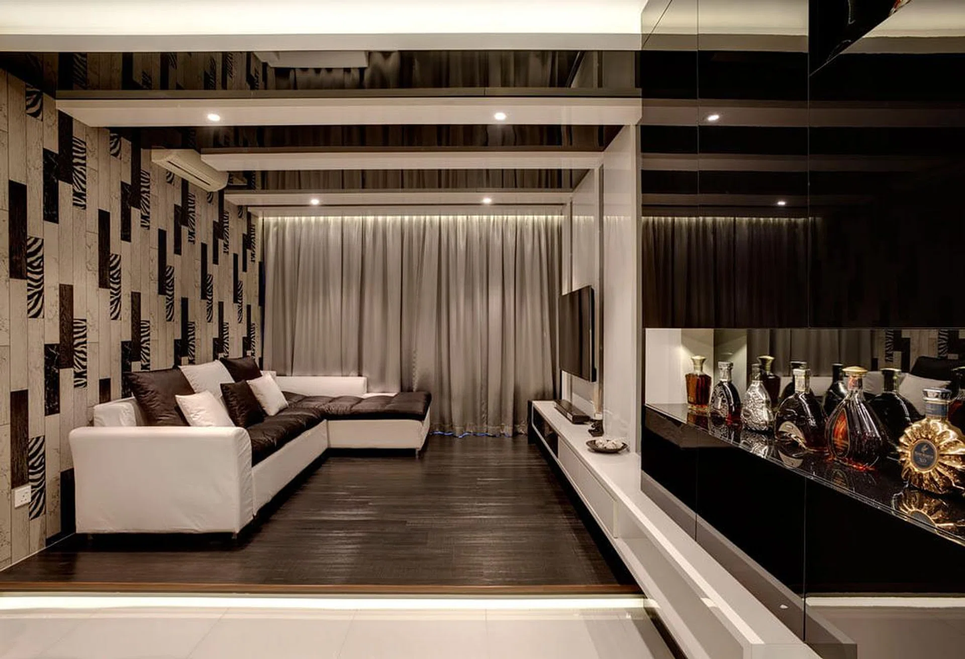 Living room in a dark modern luxury, three-bedroom condominium