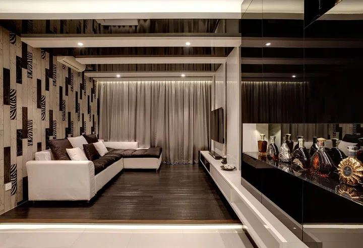 Living room in a dark modern luxury, 3-bedroom condominium in Yio Chu Kang.