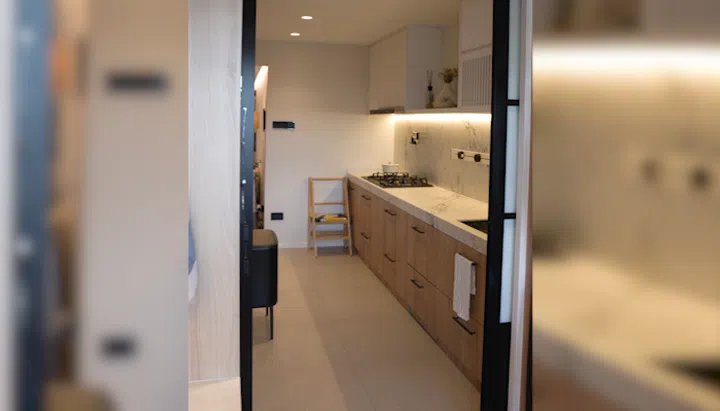 Kitchen in interior designer Cedrick Law and wife Chua Tse Lyn's 4-room HDB resale flat in Bedok.