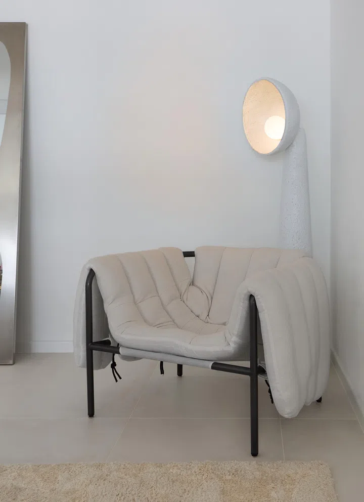 The corner occasional chair is from Taobao, as well as the quirky-shaped floor-length mirror, the white ceramic lamp, the Tom Dixon-esque chrome wall sconce, and the standing reading lamp next to the sofa. 
