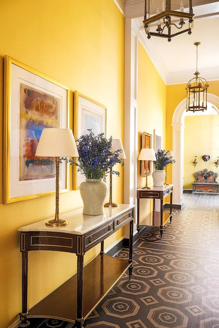 Walls in Gracie Studio Silk. Hand stenciled floor by Kristen Bunting. Pair of Louis XVI Jansen Console Tables. Brass lamps By Vaughan Designs. 19th C. Painted Italian bench.
