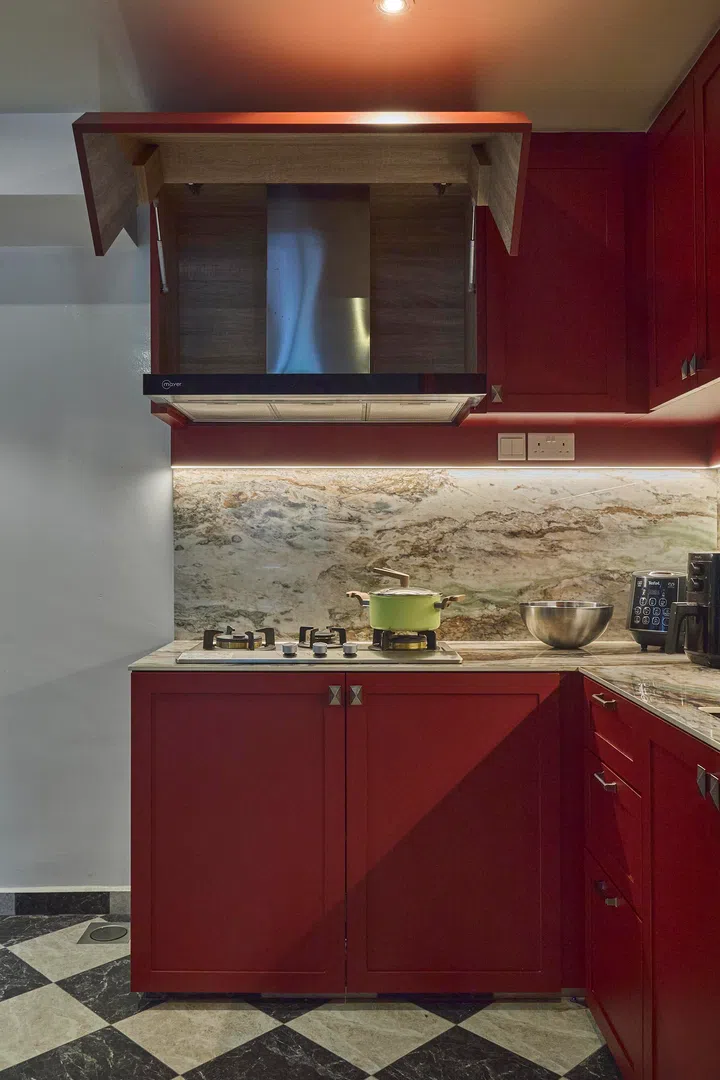 A hidden hood reveals itself when in use, combining function with a seamless exterior.