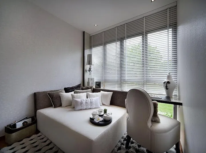 Furnish it with an inviting daybed with lots of throw cushions (go for fabrics like velvet and jacquard), a soft, high-pile area rug and a snug armchair.