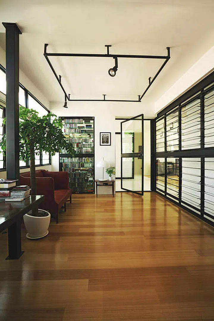 These glass window shutters serve the same purpose, and it also allows more ventilation to pass through the room as well. (Interior design by Museum)