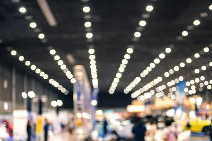 Abstract blur people in trade show expo for background.