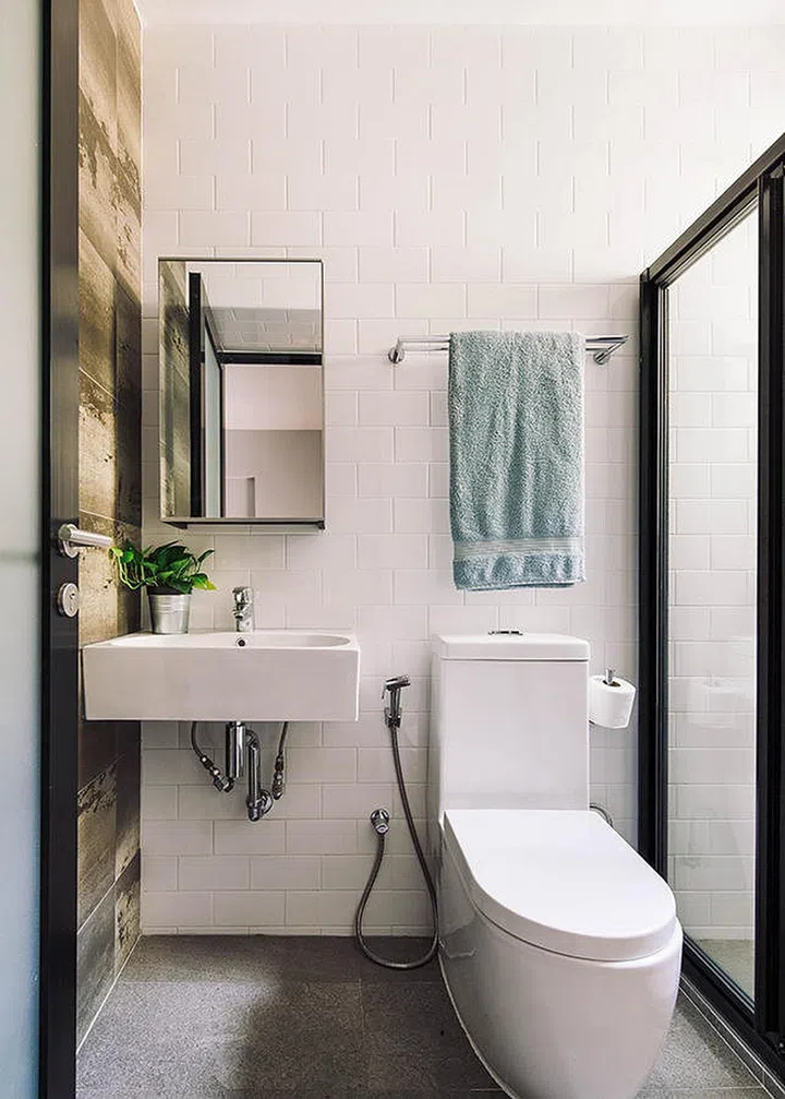 If you want a feature wall, keep the rest of your bathroom simple. Interior Design by The Scientist