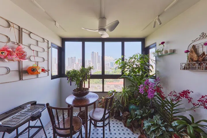 Morning light streams into the balcony, which also helps channel airflow through the flat together with the kitchen windows.