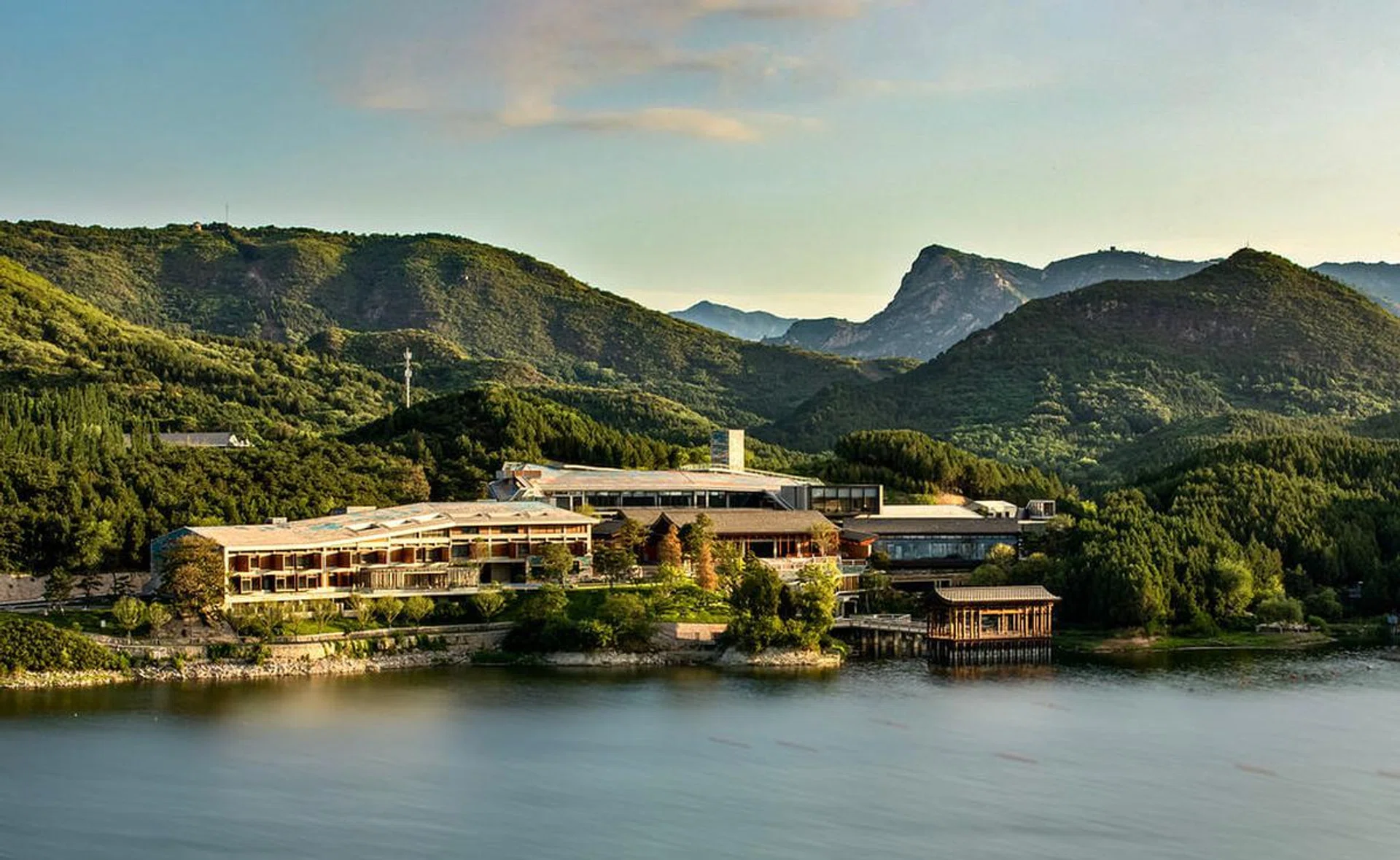 Bird's eye view of the hotel, Yanbai Villa, in the outskirts of Beijing against a green, mountainous landscape. Image from Small Luxury Hotels Yanbai Villa website.