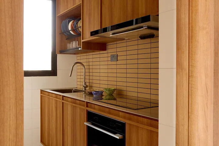 Separated from the entertaining area, the compact wet kitchen is designed for everyday cooking.