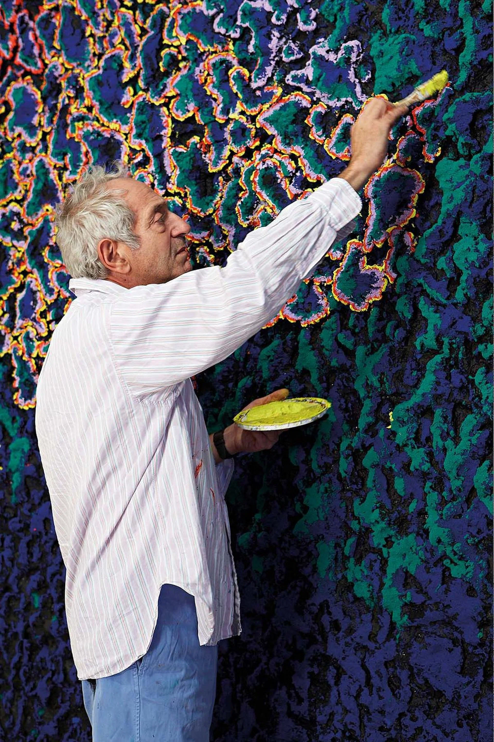 Nabil Nahas, Lebanese artist, at work on one of his huge canvases.