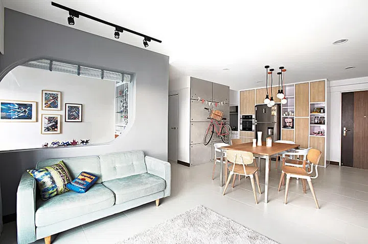 This home jazzes up its wood-and-white palette with colourful accessories, decorations and furniture. Interior design by Free Space Intent.